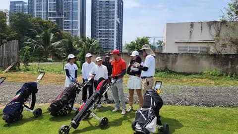 Group with golf trolleys